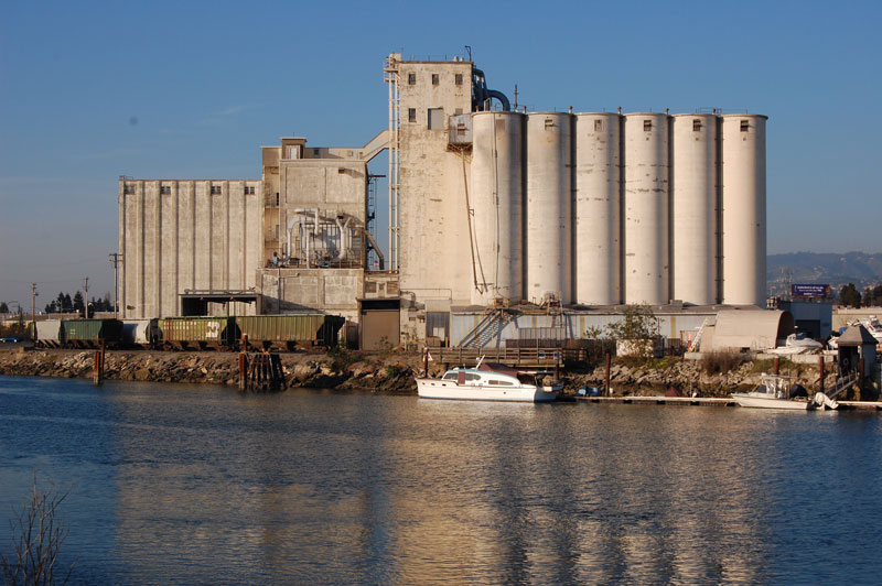 The ConAgra grain elevators and adjoining rail line beside the estuary.